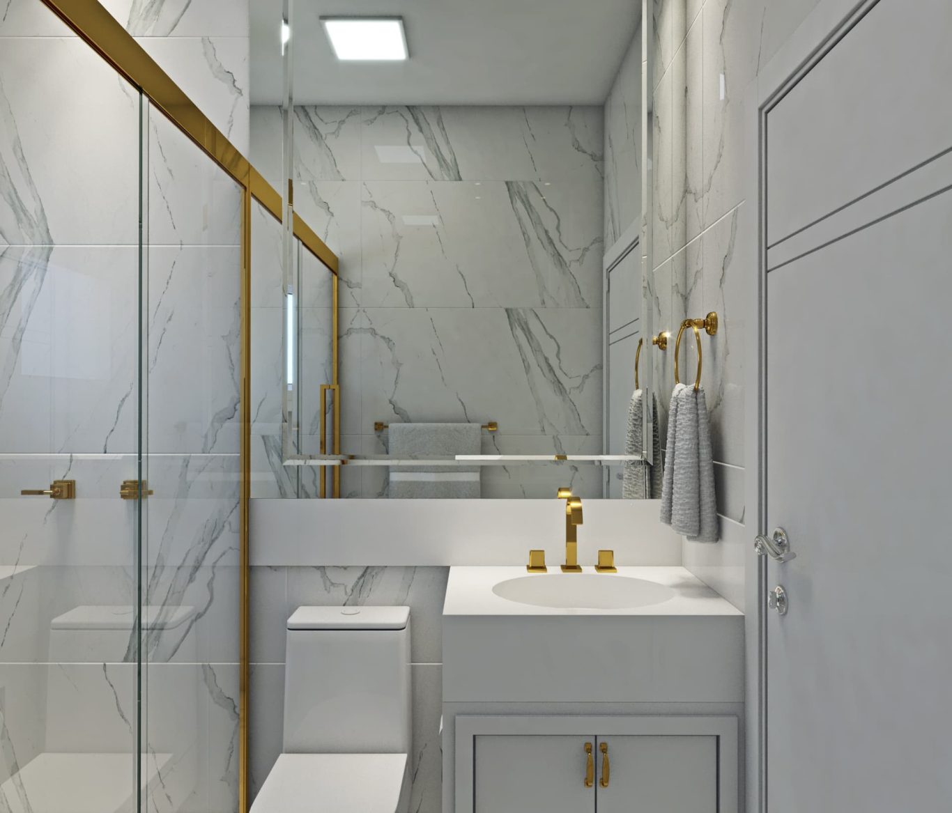 Banheiro com Mármore Branco e Detalhes Dourados